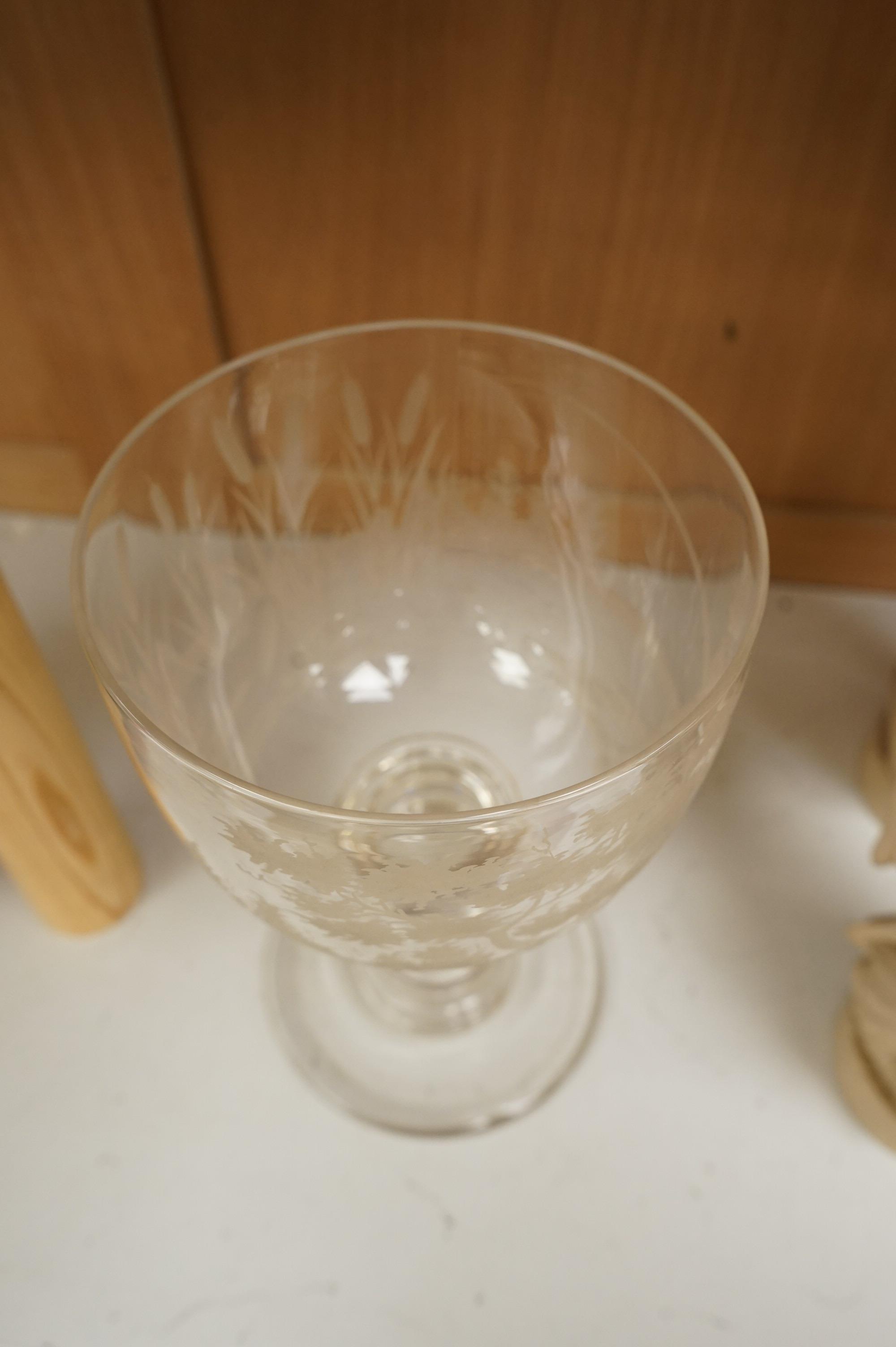 Fishing interest, a large mid 19th century glass goblet, engraved with a fisherman, bull rushes and foliage, 23cm high